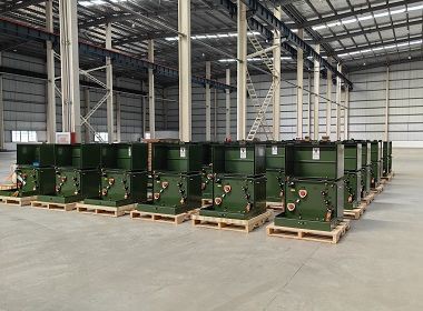 Finished pad-mounted transformer units staged on production floor Finished pad-mounted transformer units staged on production floor